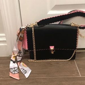 Black and pink lettuce edge purse